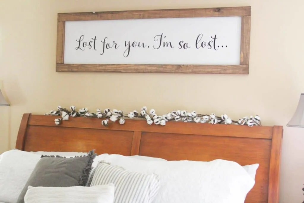 farmhouse sign above headboard