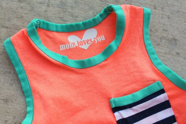 sleeveless coral t-shirt with iron on clothing label