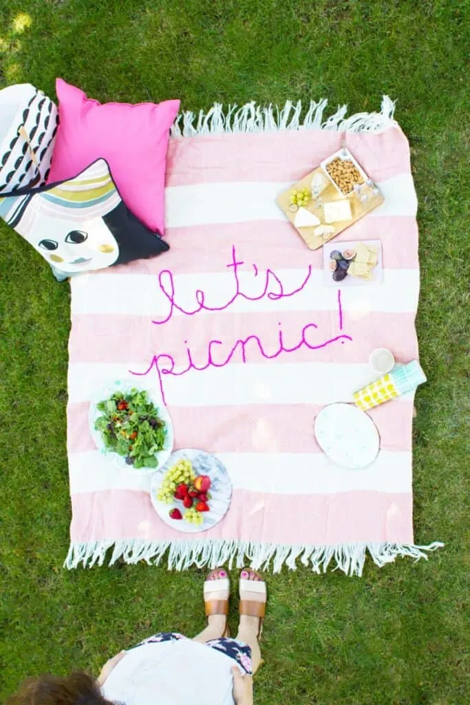 striped picnic blanket on grass