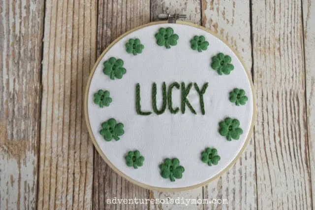 word lucky in embroidery stitches on a hoop