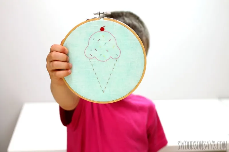 girl holding embroidery hoop