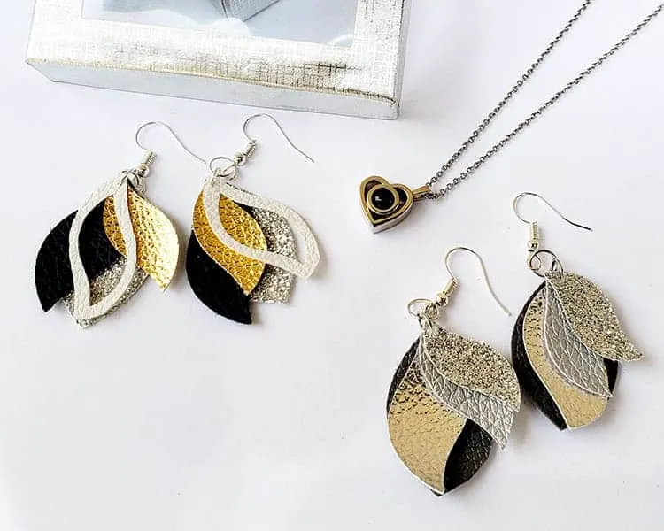 Feather shaped earrings on a table
