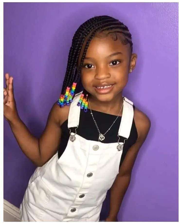 Black girl with cornrows and rainbow beads