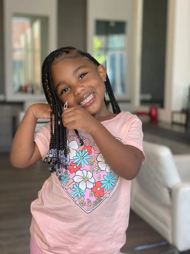 little girl wearing lemonade braids