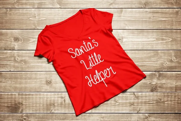short sleeve t-shirt with santa's little helper written on the front