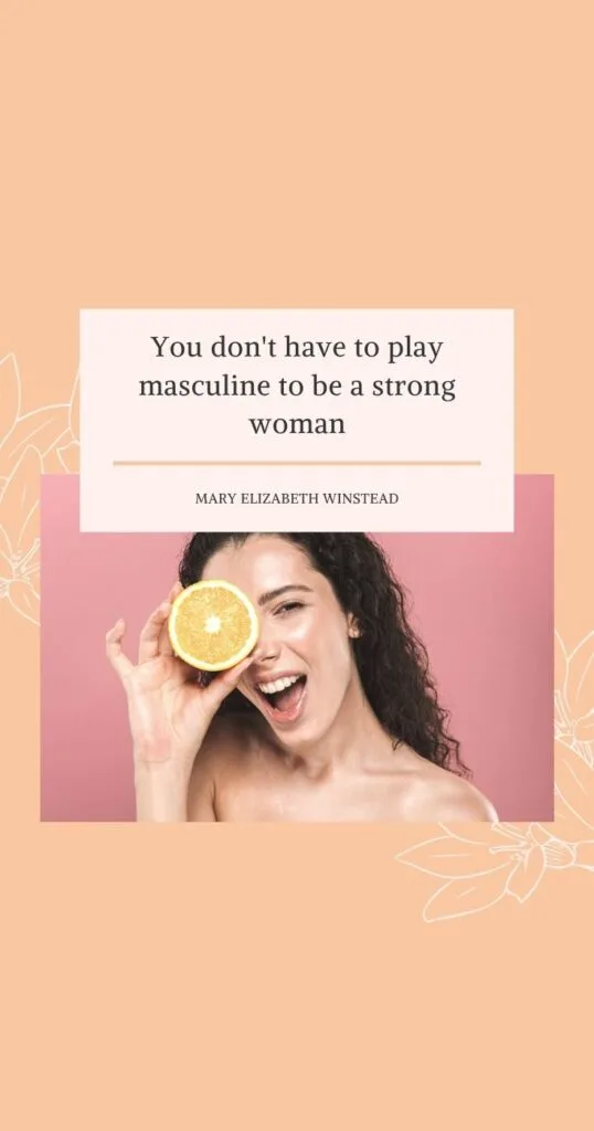 woman holding an orange slice