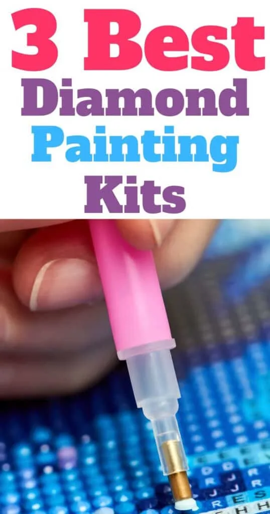 hand holding a pink applicator pen to make a diamond painting