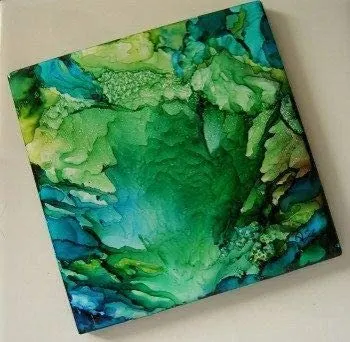 square ceramic blank tile painted with alcohol ink in shades of green and blue