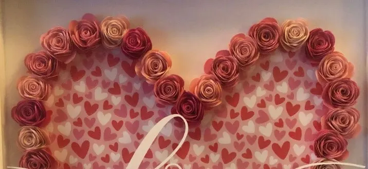 pink paper roses in a heart shape