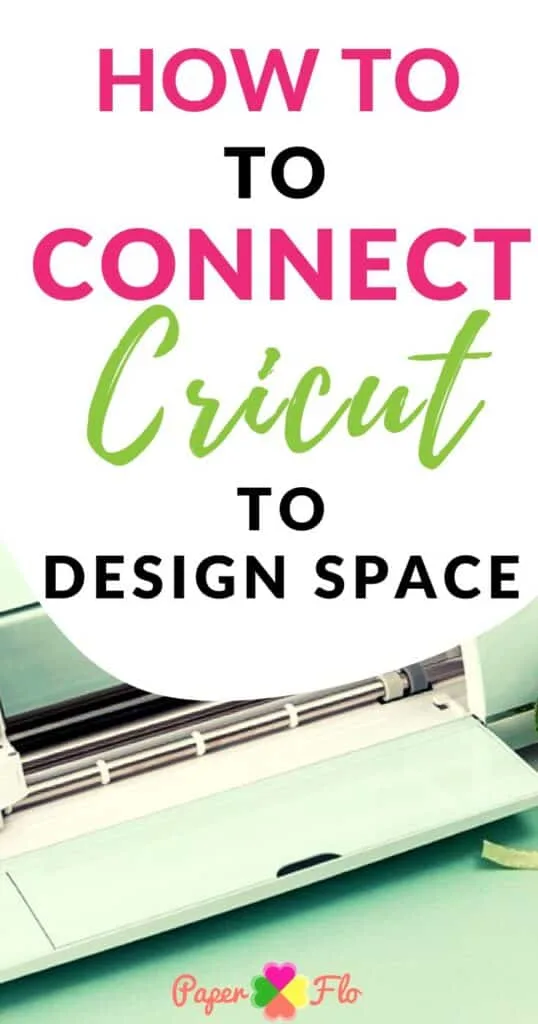 Cricut cutting machine on a table with a cutting mat coming out of the machine.