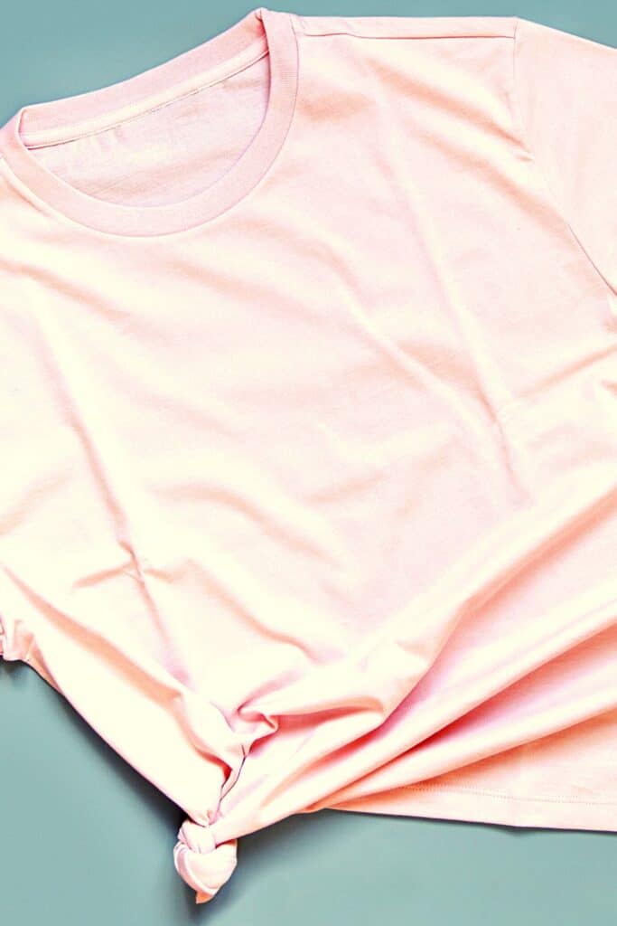 A pink t-shirt with a knot tied in one corner.