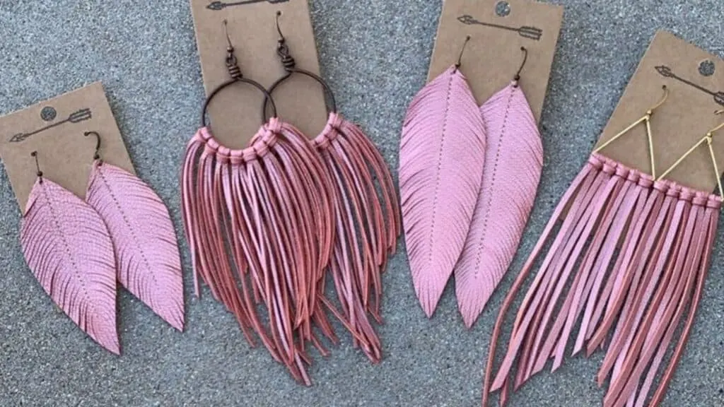 pink feather faux leather earrings