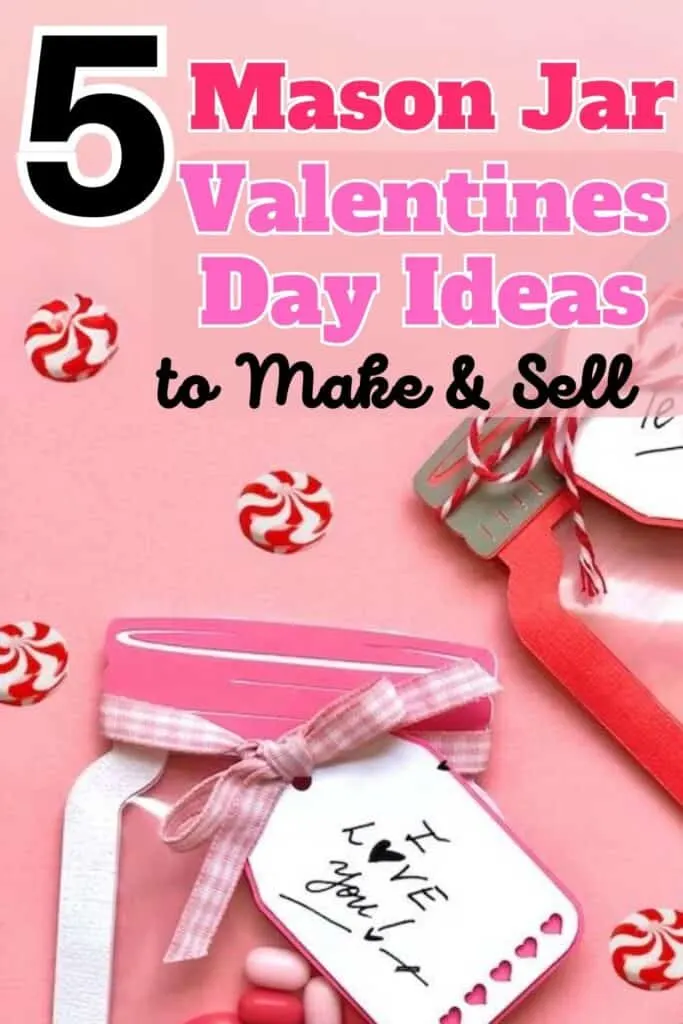 An image featuring a bright pink background with a large graphic text overlay that reads "5 Mason Jar Valentine's Day Ideas to Make & Sell." Below the text, there's a tilted pink mason jar with a white tag attached by a gingham ribbon. The tag says "LOVE you!" in handwritten font with small hearts. Scattered around the jar are candy pieces with red and white swirls. The overall vibe is festive and crafty, aimed at DIY enthusiasts.