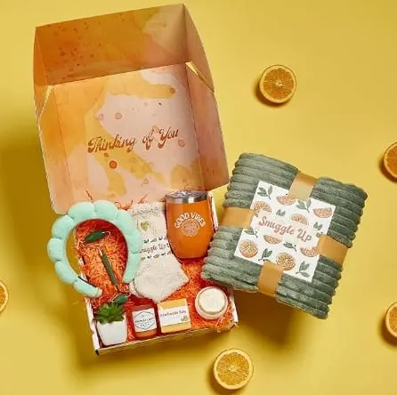 Self care package with tumbler, jade roller, headband and soap in a box