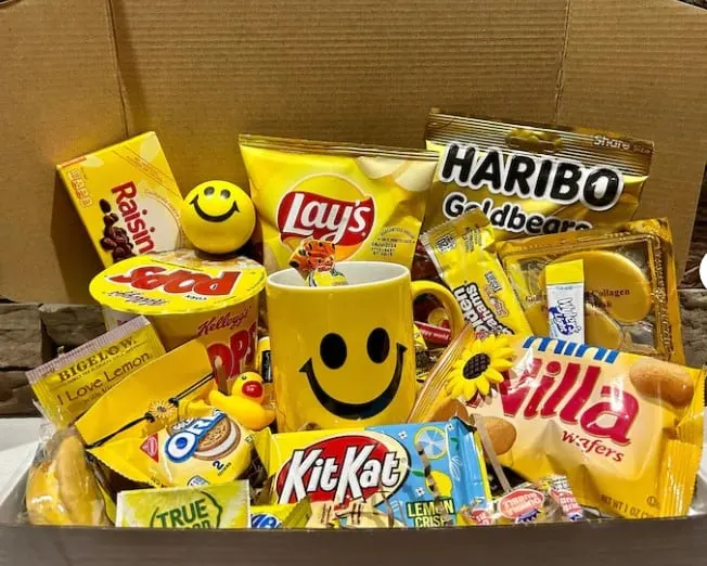 A care package for a freshman filled with yellow themed snacks.